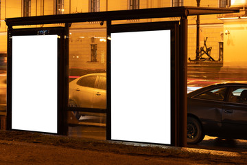 Wall Mural - two billboard in one stop nearby glow box. White field for advertising glowing at night in the city. Vertical Field Mockup