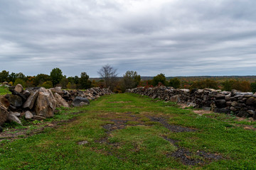 Wall Mural - path with old stone walls in countryside setting