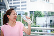 © SUPERMAO - Fitness women Drink clean water to keep the body fresh.