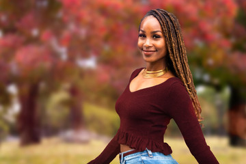 portrait headshot of a beautiful commercial model african american woman, cheerful casual attire in 