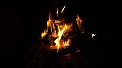 slow motion video of cosy fireplace with reddish fire during holidays