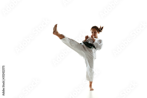 Fotografía Confident junior in kimono practicing hand-to-hand combat, martial arts