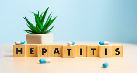 Wooden block form the word HEPATITIS. Medical concept.