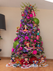 Wall Mural -  Christmas tree with traditional Mexican decorations, rag dolls, traditional colored ribbons of Mexican culture