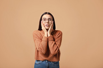 Sticker - Portrait of worried young woman on color background