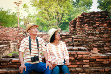 Happy elderly couple Travel Ancient archaeological sites with history in Asia