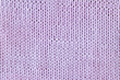 Violet or purple knitted textured background