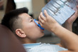© donikz - A man drinks water from a five-liter plastic bottle