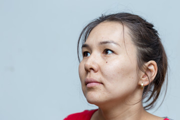 Portrait of a simple girl on a white background