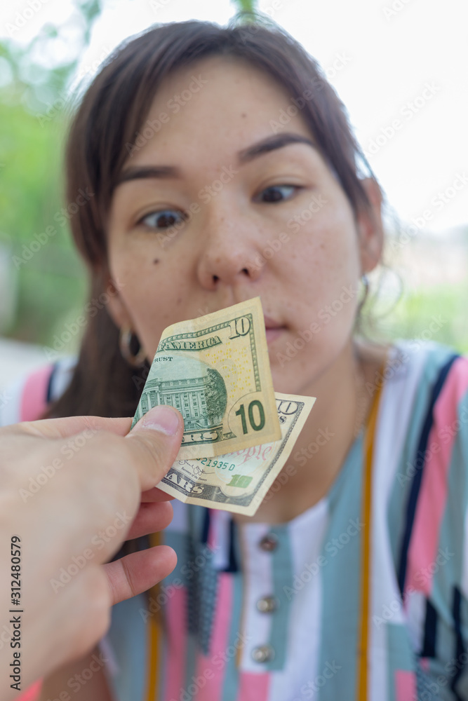 Offer dollar bills. A man offers a girl money for sex Stock Photo | Adobe Stock Offer dollar bills. A man offers a girl money for sex Stock Photo | Adobe Stock
