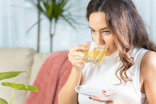 Woman drinking herb tea