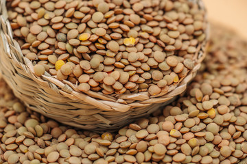 Wall Mural - Healthy organic dried lentils in a straw basket