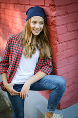 lifestyle outdoor portrait of young smiling teenage girl