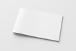 © dimamoroz - Horizontal brochure or booklet cover mock up on white. Isolated with clipping path around brochure. Side view. 3d illustratuion