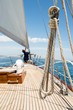 Man working on prow of yacht