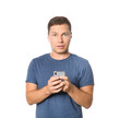 © Pixel-Shot - Portrait of surprised man with mobile phone on white background