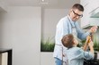 © MDBPIXS - Happy father and son preparing spaghetti in kitchen