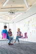 © MDBPIXS - Businesspeople working at creative office space