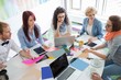 © MDBPIXS - High angle view of businesspeople analyzing photographs in creative office