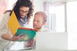 © MDBPIXS - Creative business colleagues discussing over file in office