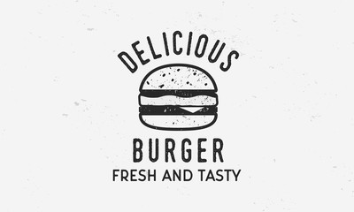 Wall Mural - Delicious Burger - vintage logo template with burger silhouette and grunge texture. Vector illustration