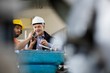 © MDBPIXS - Male supervisor with worker examining metal in industry