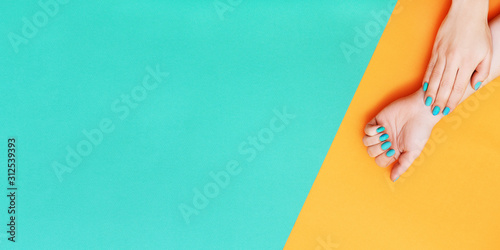 Perfect manicure with nail art on orange and green background Tableau sur Toile