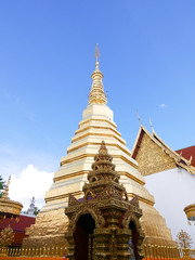 Wall Mural - Golden pagoda in Wat Phrae, Thailand