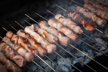 Pork meat kebab, souvlaki, cooked on a charcoal barbecue grill