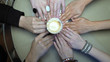 © kopitinphoto - The concept of a spiritualistic session. people hold hands on a moving saucer