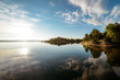 © Chris Zielecki/Stocksy - Calm water surface of lake in evening