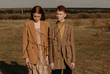 Teenager Models Tied Up With Rope In Field