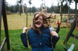 © Rob and Julia Campbell/Stocksy - Girl on swing