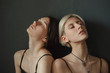 © Dmytro Bilous/Stocksy - portrait of blondes and brunettes together on a neutral background with closed eyes