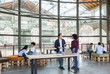 © Garage Island Crew/Stocksy - Young businesspeople working in a modern startup in a contempora