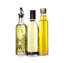 Different Sorts Of Cooking Oil In Bottles Isolated On White