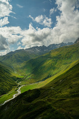 The Furka Pass  is a high mountain pass in the Swiss Alps connecting Gletsch, Valais with Realp, Uri. The Furka Oberalp Bahn line through the Furka Tunnel