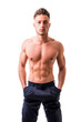 © theartofphoto - Handsome shirtless athletic young man wearing only pants, with blue eyes, looking at camera in studio shot, isolated on white background