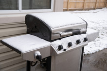 Uncovered Grill Has Fresh Snow Fall On Top