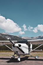Single Engine Piston Cessna 172 Parked At An Airfield In The Mountains