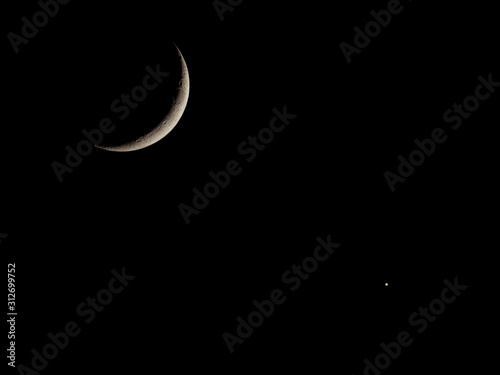Fotomural Waxing crescent moon seen with telescope