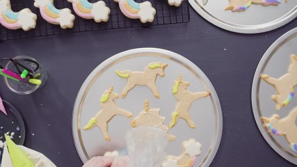 Sticker - Flat lay. Step by step. Decorating unicorn sugar cookies with royal icing.