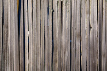 Rustic Background Of Weather Wood Fence On A Sunny Day