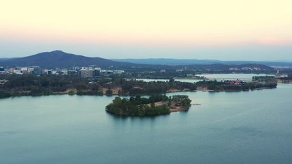 Wall Mural - Aerial panoramic view of Lake Burley Griffin traveling toward Springbank Island looking at Canberra City in Australia 