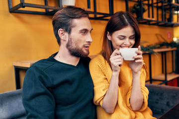 Canvas Print - man and woman drinking coffee in cafe