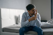 © SHOTPRIME STUDIO - man sitting on sofa and talking on cell phone
