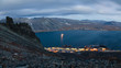 Epic landscape with the port town of Provideniya. A beautiful evening panorama of Providence Bay, surrounded by rocky mountains and hills. Location: Provideniya, Chukotka, Siberia, Far East of Russia.