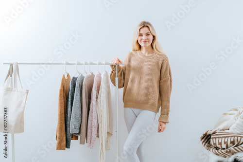 Photographie Young woman choosing shoes in dressing room