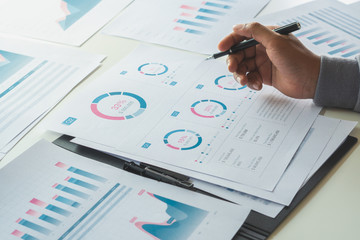 Poster - businessman working calculate data document graph chart report marketing research development planni