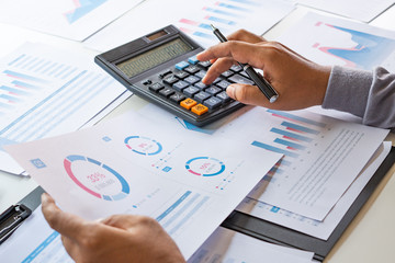 Poster - businessman working calculate data document graph chart report marketing research development planni